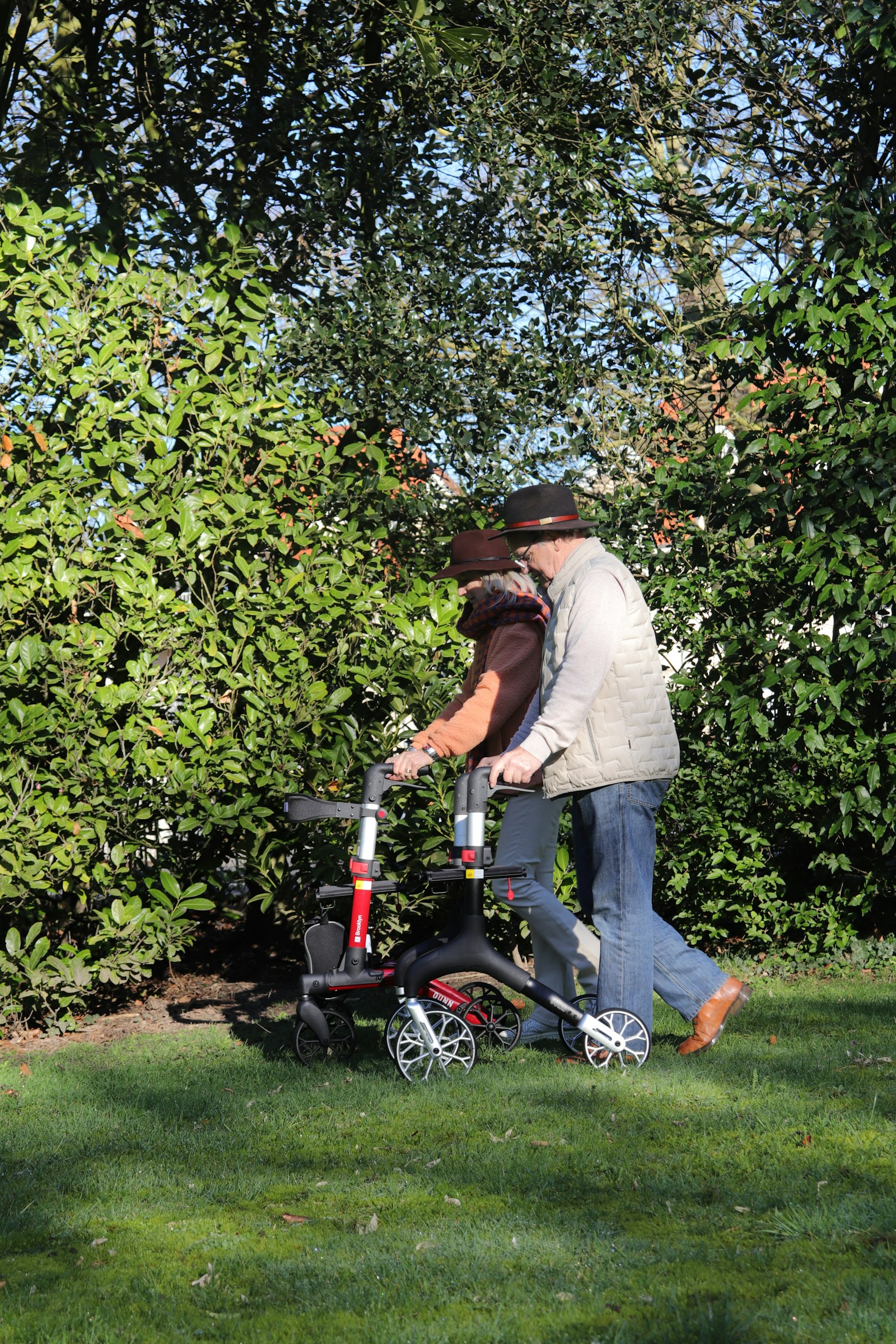 Illustrative older couple enjoying a garden walk